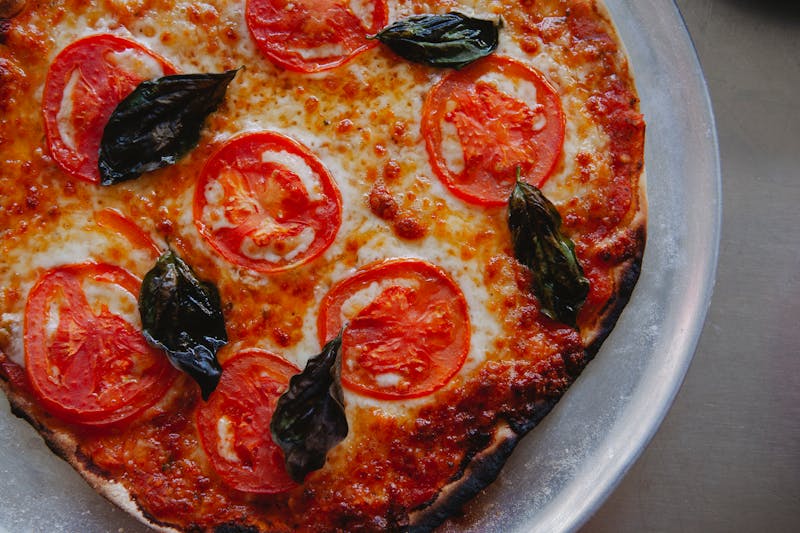 Margherita Classica pizza with fresh basil and buffalo mozzarella